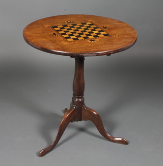 A 19th Century circular mahogany and oak snap top table inlaid a chessboard, raised on an oak turned column and tripod base 25"h  x 23"diam.