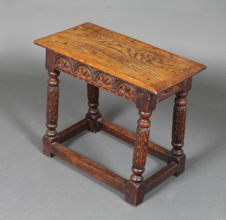 A 17th Century style rectangular carved oak joint stool with arcaded decoration, raised on turned and block supports 18"h x  21"d x 11"w