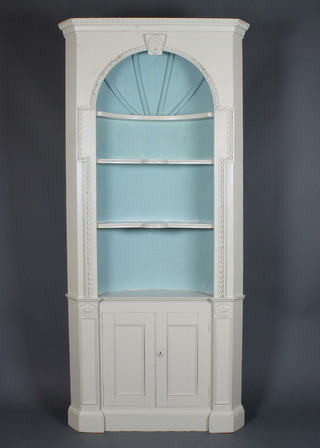 A Regency style grey painted open corner cabinet with moulded cornice, fitted 4 shelves above a cupboard 84"h x 37"w x 20"d