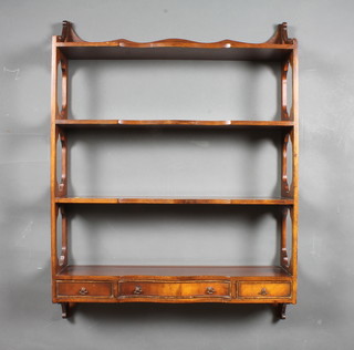 A Regency style 4 tier wall mounting bookcase fitted 1 long and  2 short drawers 36"h x 27"w x 7"d