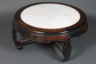 A circular Chinese Padouk table with white veined marble top, raised on panel supports 18"h x 36"diam.
