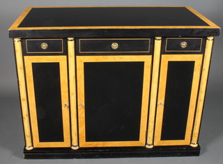 A Biedermeier style side cabinet fitted 1 long and 2 short drawers above triple column 35"h x 47"w x 24.5"d