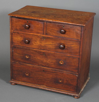 A 19th Century mahogany D shaped Bachelors chest of 2 short  and 2 long drawers with tore handles raised on bun feet 26"h x  26"w x 15"d