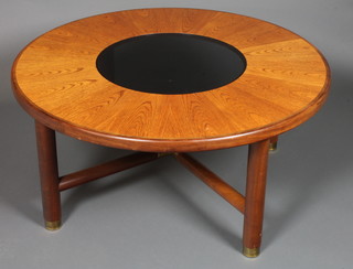 A circular teak G Plan coffee table with smoked glass panel to  the centre 17"h x 38"diam.