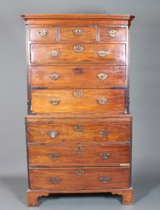 A George III mahogany chest on chest, the upper section with moulded cornice above 3 short and 3 graduated long drawers,  flanked by fluted chamfered corners, the lower section with  brushing slide and a further 3 graduated long drawers raised on  shaped bracket feet 73"h x 42"w x 22"d