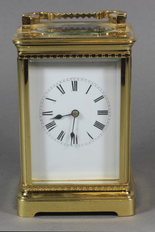 A late 19th Century French gilt brass corniche cased carriage clock, having Roman enamelled dial, lever escapement, the 8 day  movement chiming gong, raised on plinth base 7.5"h x 4"w x  3.5"d  ILLUSTRATED