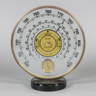A Jaeger LeCoultre Art Deco thermometer contained in a  circular glass and brass mounted case 6.5", glass f,