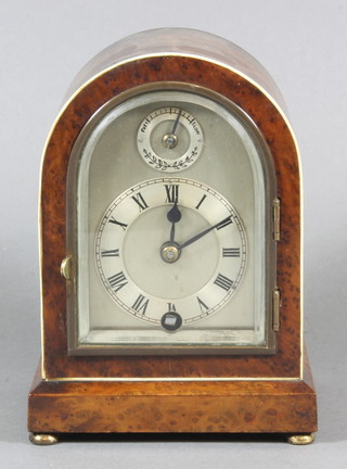 A Georgian style miniature bracket clock with 2.5" silvered dial, the chapter ring with Roman numerals contained in an arch  shaped burr walnut case by Astral