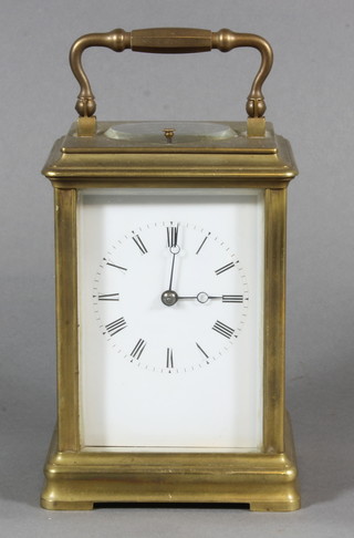 A 19th Century French striking carriage alarm clock with  enamelled dial and Roman numerals contained in a gilt case