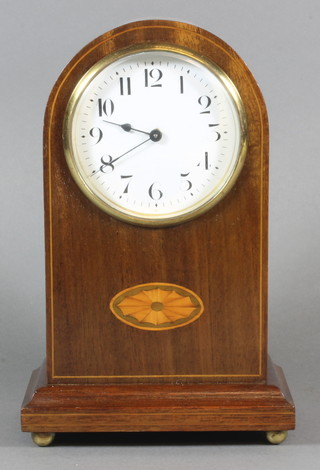 A French timepiece with enamelled dial and Arabic numerals contained in an arched inlaid mahogany case