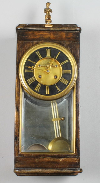 A 19th Century domestic Vienna wall regulator, re-cased, having polished brass and parcel ebonised Roman brocot dial, the  cylinder movement striking bell and stamped S Wartenberg Paris,  22"h x 9"w x 7"d