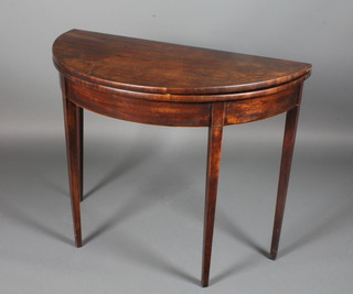 A Georgian demi-lune tea table raised on square tapering  supports 29"h x 36"w x 18"d