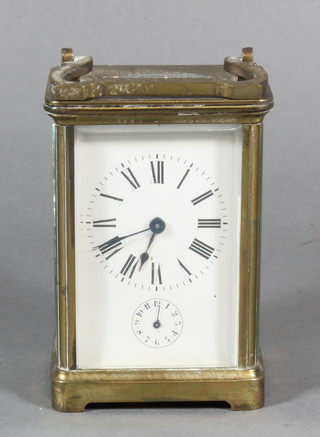 A 19th Century French 8 day carriage alarm clock contained in a  gilt metal case, glass f, bell missing,