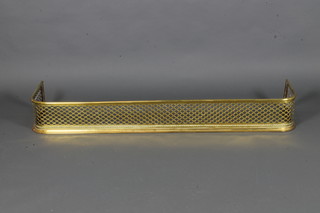 A Victorian pierced brass fender 54"