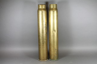 A Continental 7.6cm brass shell case and 1 other