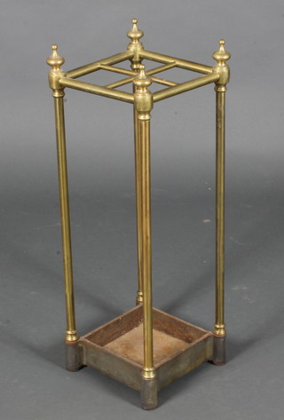 A brass stick/umbrella stand complete with iron drip tray 25"h
