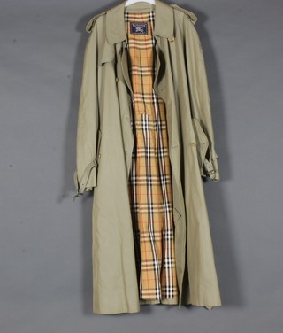 A Burberry double breasted trench coat
