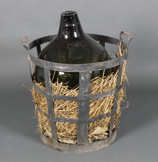 A large glass carbide contained in a circular metal twin handled brazier 22"