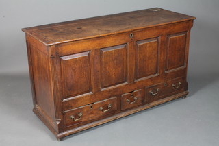An early George III oak mule chest with hinged top above a 4  panelled front with 3 drawers fitted below, flanked by fluted  chamfered corner and raised on end stiles 31"h x 55"w x 20.5"d