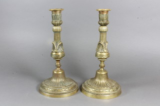 A pair of 19th Century gilt metal fluted candlesticks 10"
