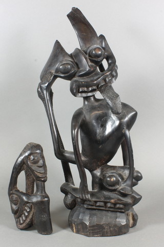 A carved African figure of a mythical beast with snake 18" and 1  other 7"
