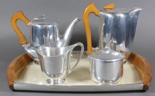 A Picquot ware 5 piece tea/coffee service comprising twin  handled tea tray, hotwater jug, teapot, coffee pot and sugar bowl