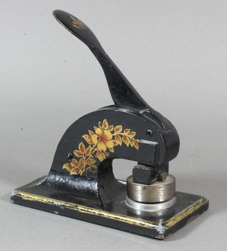 A painted metal letter press for T C Managements Ltd