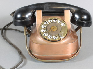 A Continental copper and brass mounted telephone