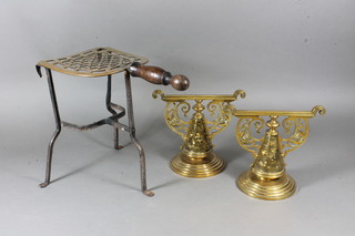 A pair of Victorian pierced brass bell shaped fire dogs 7" together with an iron and steel footman