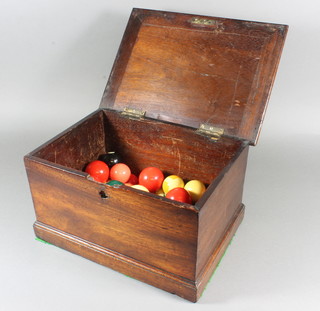 A Victorian rectangular mahogany box containing a collection of billiard and pool balls