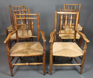 A harlequin set of 6 19th Century fruitwood and elm rush seat chairs with spindle backs on tapered legs