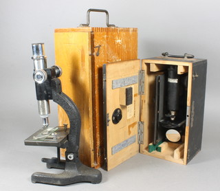 A Hauptner single pillar microscope and 1 other single pillar microscope