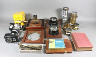 A collection of various 19th Century brass lantern slide lenses, a Ross 95mm projector lens, a Minolta camera etc