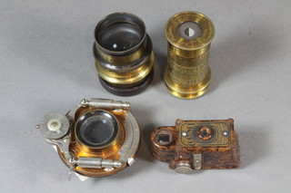 A Coronet midget camera in a brown Bakelite case, a  Bausch-Lomb camera lens, a Watkins exposure metre by R Field  & Co Birmingham and 1 other lens
