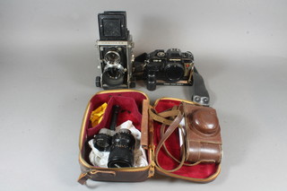 A Minolta C3 camera, a Russian copy of a Leica camera by  Version, a Chinon ce-5 camera together with a Crown zoom lens  F:1.8 F=10-30mm No.82518