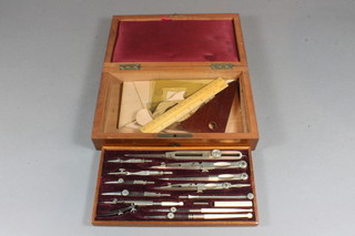 A Victorian polished steel geometry set contained in a mahogany box with hinged lid