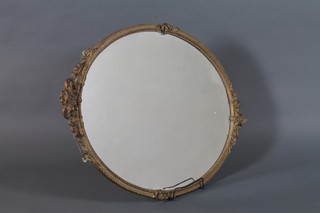 A late 19th Century carved gilt wood oval wall mirror in the neo classical style, having acanthus leaf and lattice decoration 33"h x  25"w