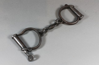 A pair of 19th Century steel hand cuffs