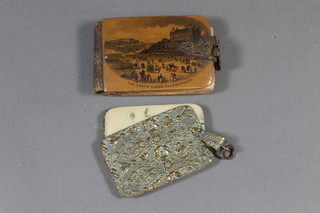 A Victorian embossed gilt metal aide memoir and a mocklyn ware aide memoir decorated view of the South Strand at Scarborough
