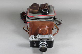 A Fed 3 camera and lens marked 6657391 2,8/52 N-61 together  with a Wiston Master V light meter