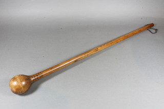 A turned wooden Knobkerrie with Hebrew script