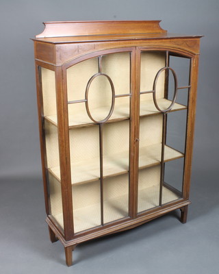 An Edwardian mahogany display cabinet in the Sheraton style  with a galleried back above a frieze decorated marquetry swags  and ribbons and a pair of bar glazed doors enclosing 2 shelves,  raised on square legs 55"h x 39"w x 14"d