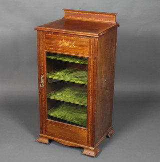 An Edwardian mahogany music cabinet inlaid satinwood, fitted shelves enclosed by glazed panelled doors 39"h x 19"w x 16"d