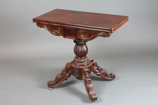 A Regency mahogany card table, the hinged revolving top  enclosing a baise lined interior raised on acanthus leaf column  support, quadripartite base with scroll feet and casters 29.5"h x  32"w x 32"d