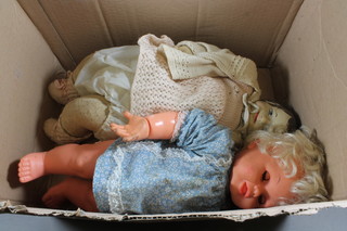 A plaster headed doll and a plastic doll
