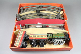 A Hornby "O" gauge train set comprising a type 20 tank engine  with green and black livery No.60985, 2 carriages No.9798  together with a quantity of track