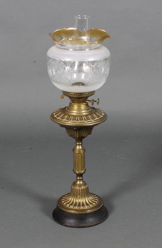 An embossed brass oil lamp