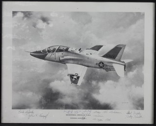 A black and white photograph of an American Navy Mcdonnal Douglas T-45A Aircraft signed by John Ward and 3 others 15" x  19.5"