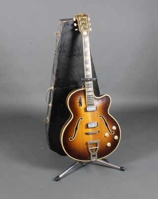 A Hofner electric guitar, labelled Hofner no.1414 Committee Brunette thin together with stand