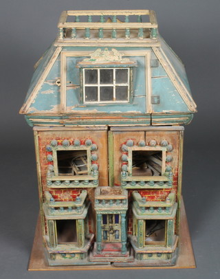 A Continental painted dolls house 33"h x 28"w x 19"d